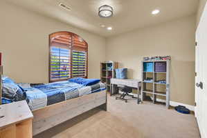 Bedroom with recessed lighting and light colored carpet