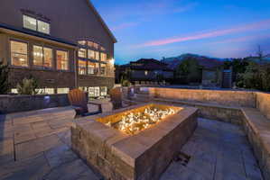 View of patio / terrace with an outdoor fire pit and a mountain view