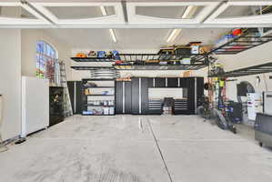 Garage featuring freestanding refrigerator