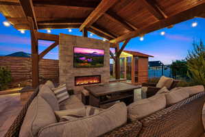 View of patio / terrace featuring an outdoor living space with a fireplace