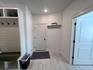 Mudroom featuring baseboards
