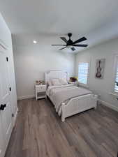 Bedroom featuring dark wood-style floors and ceiling fan