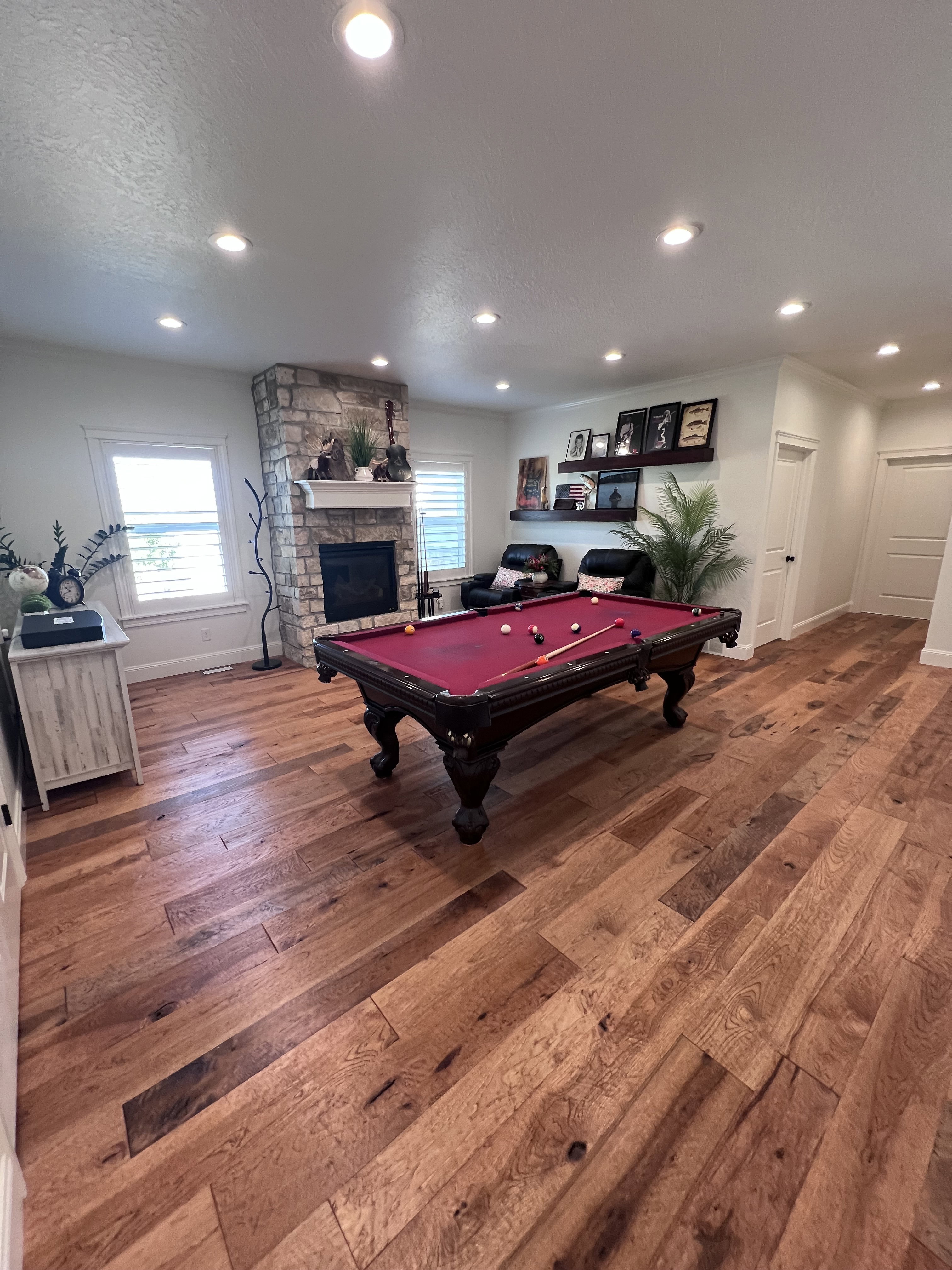 Recreation room with hardwood / wood-style flooring, billiards, a fireplace, a textured ceiling, and recessed lighting