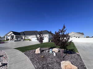 View of front of property featuring driveway and a garage