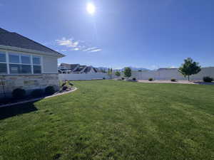 Fenced backyard with a mountain view