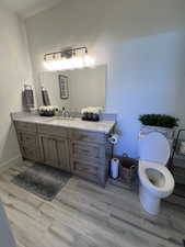 Bathroom featuring vanity and light wood-style flooring