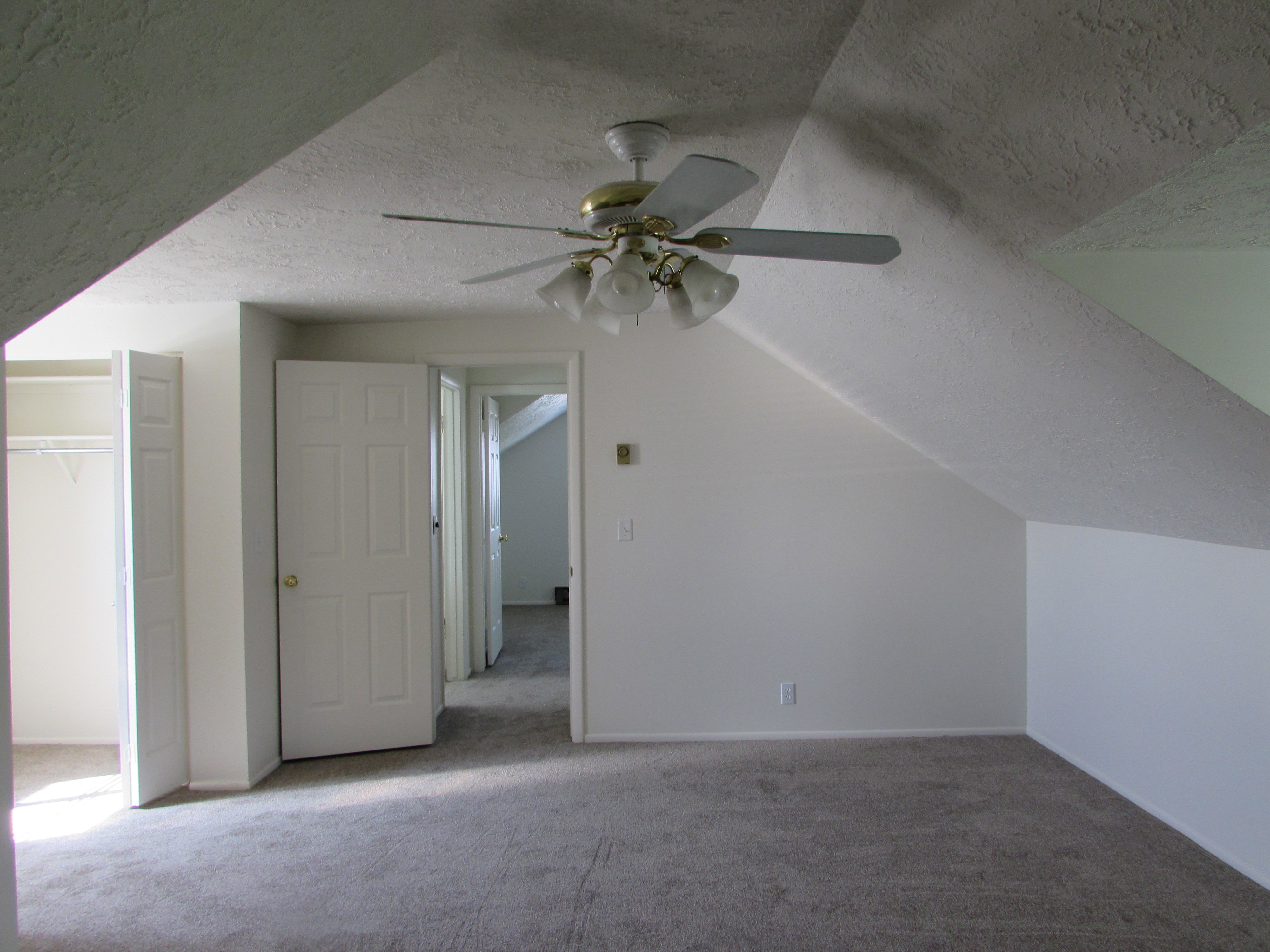 Bedroom with carpet and ceiling fan