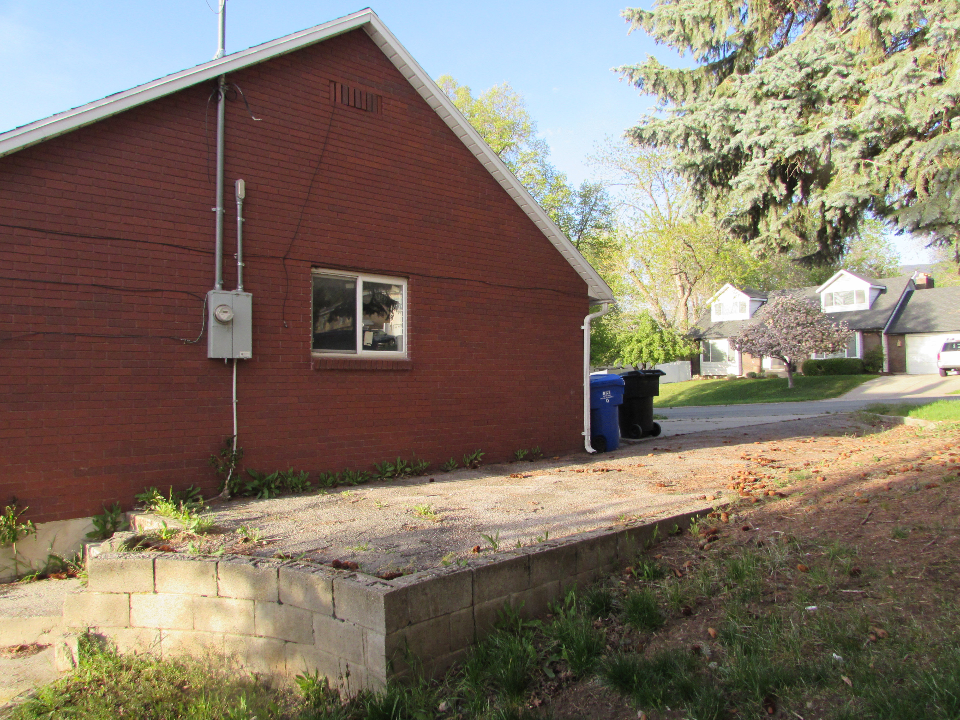 View of side of home with brick siding  and RV parking