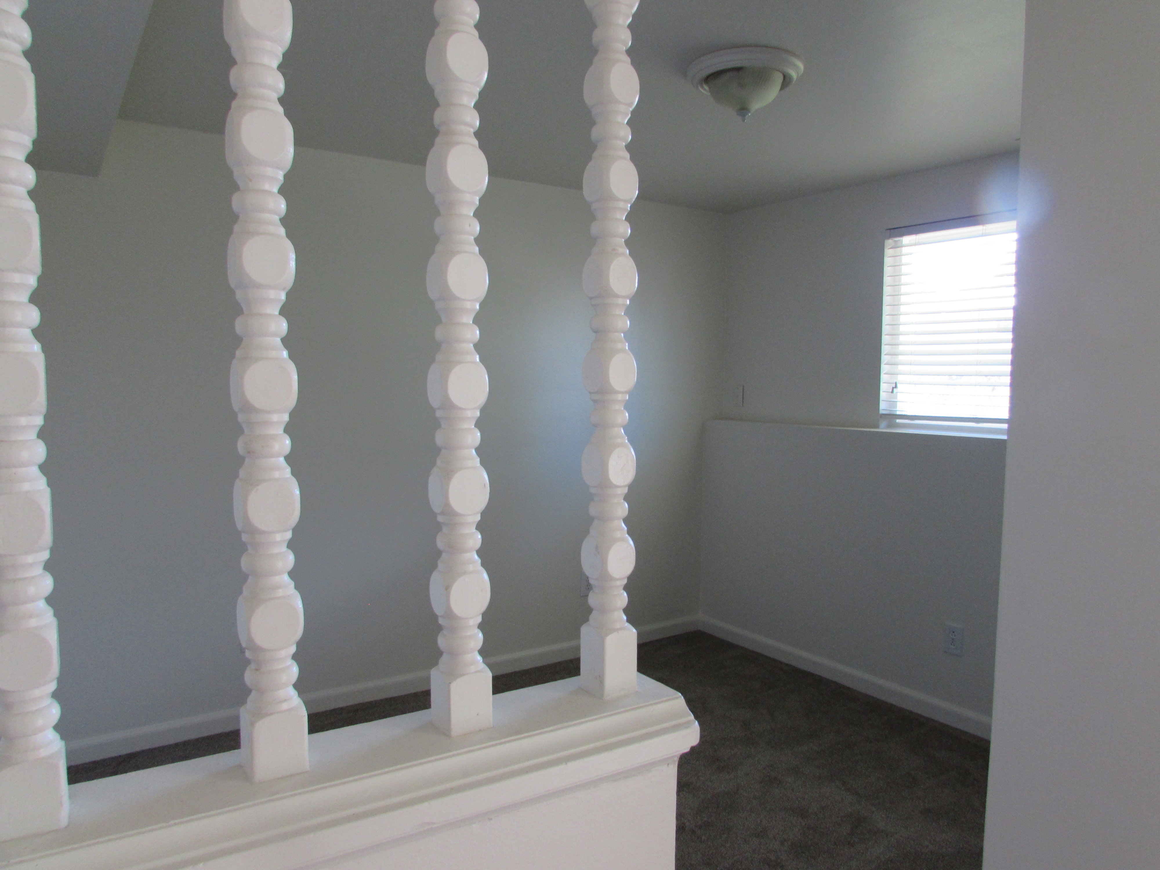 Detailed view of carpet and baseboards