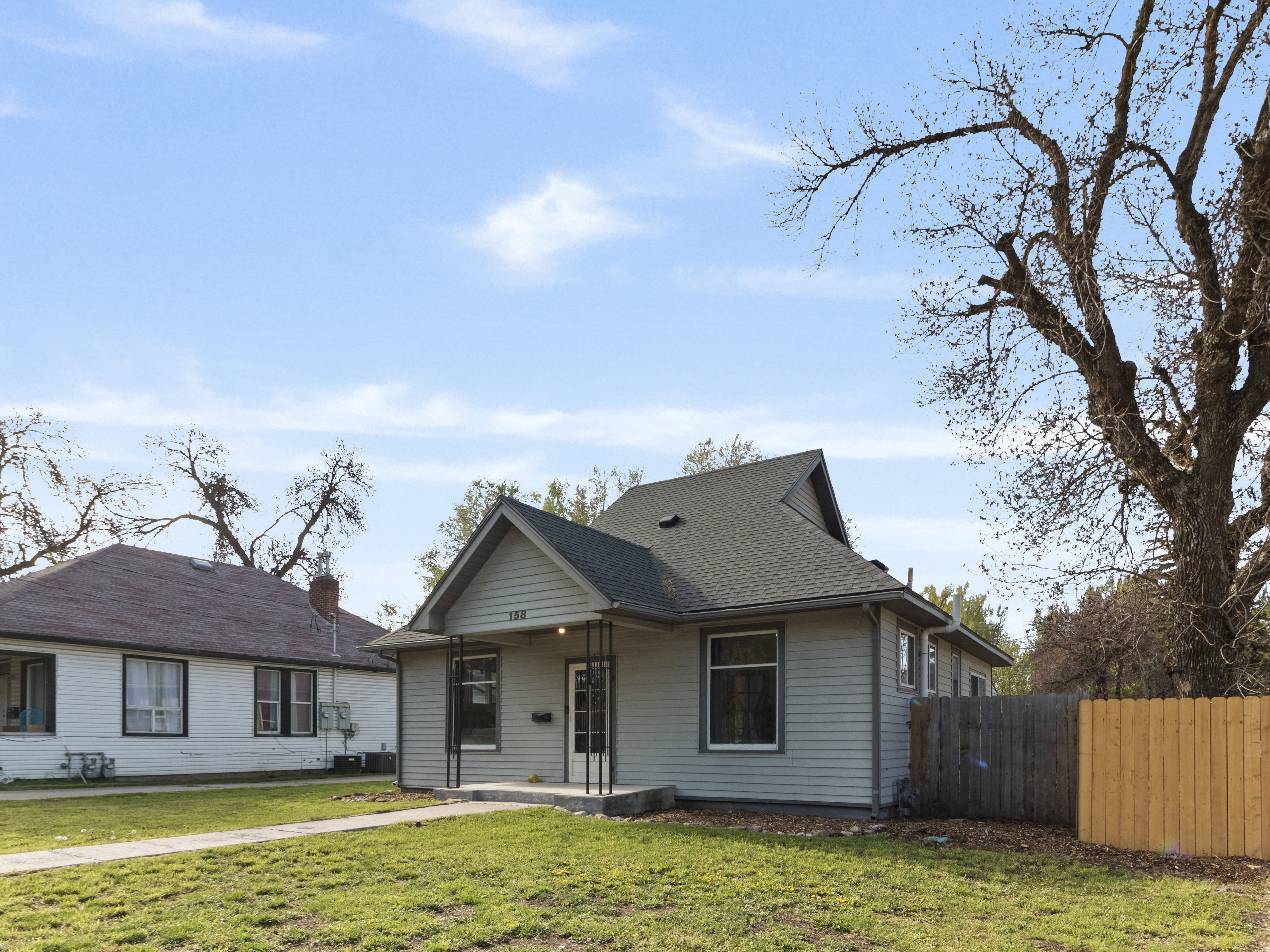 Bungalow featuring roof with shingles