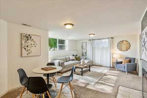 Dining space with light carpet