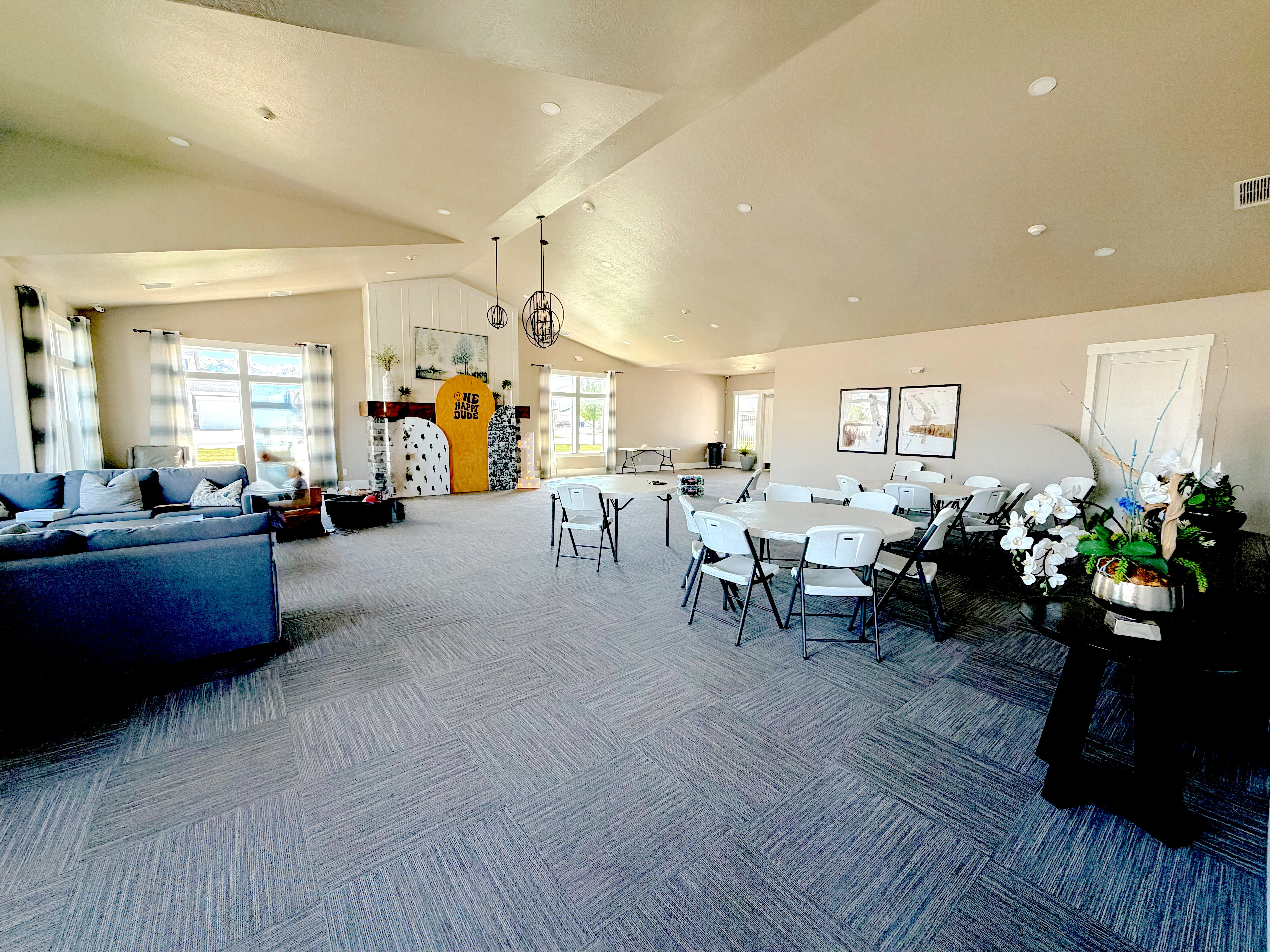 Carpeted dining space featuring a high ceiling and recessed lighting