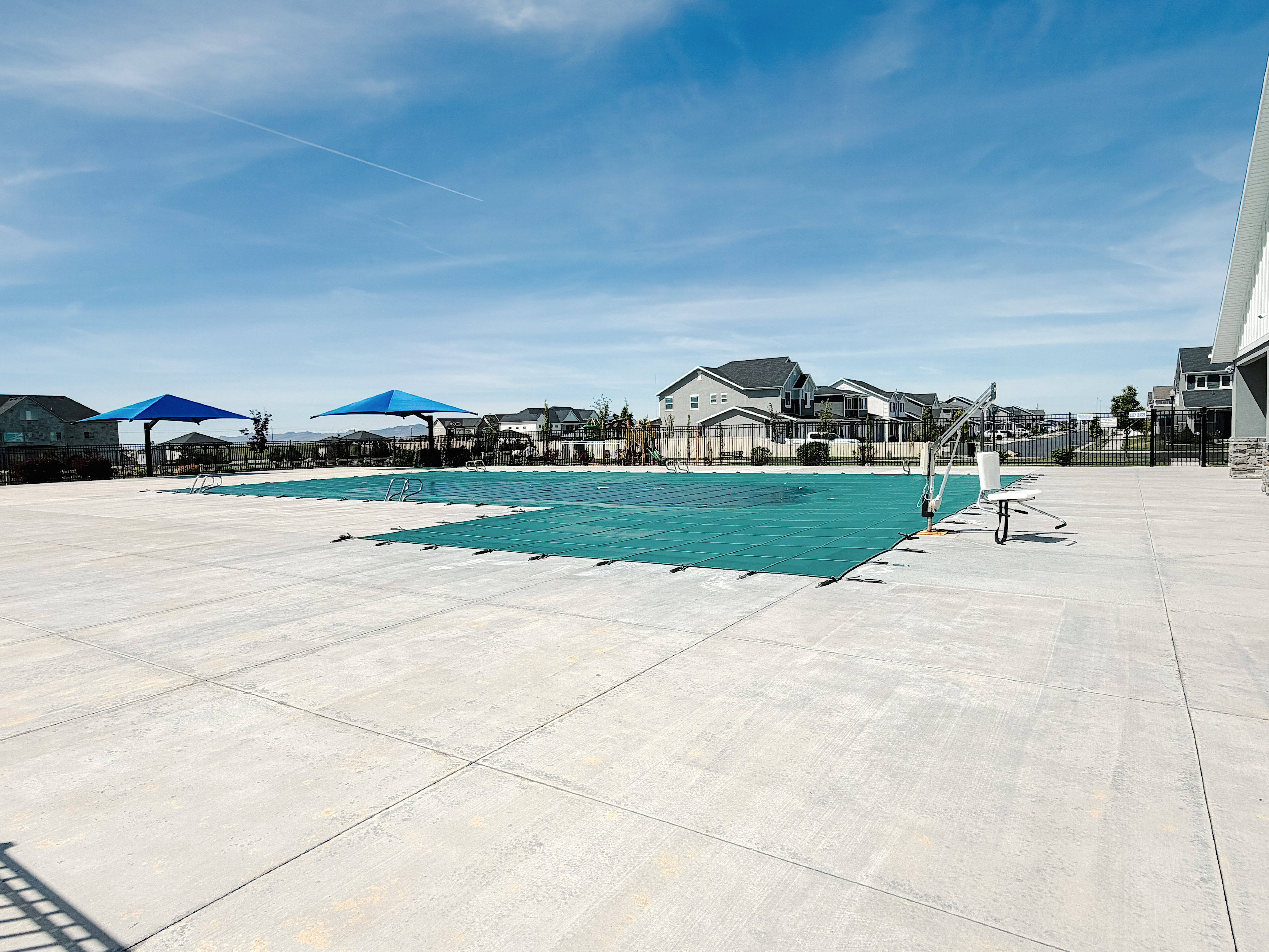 Community pool featuring a residential view