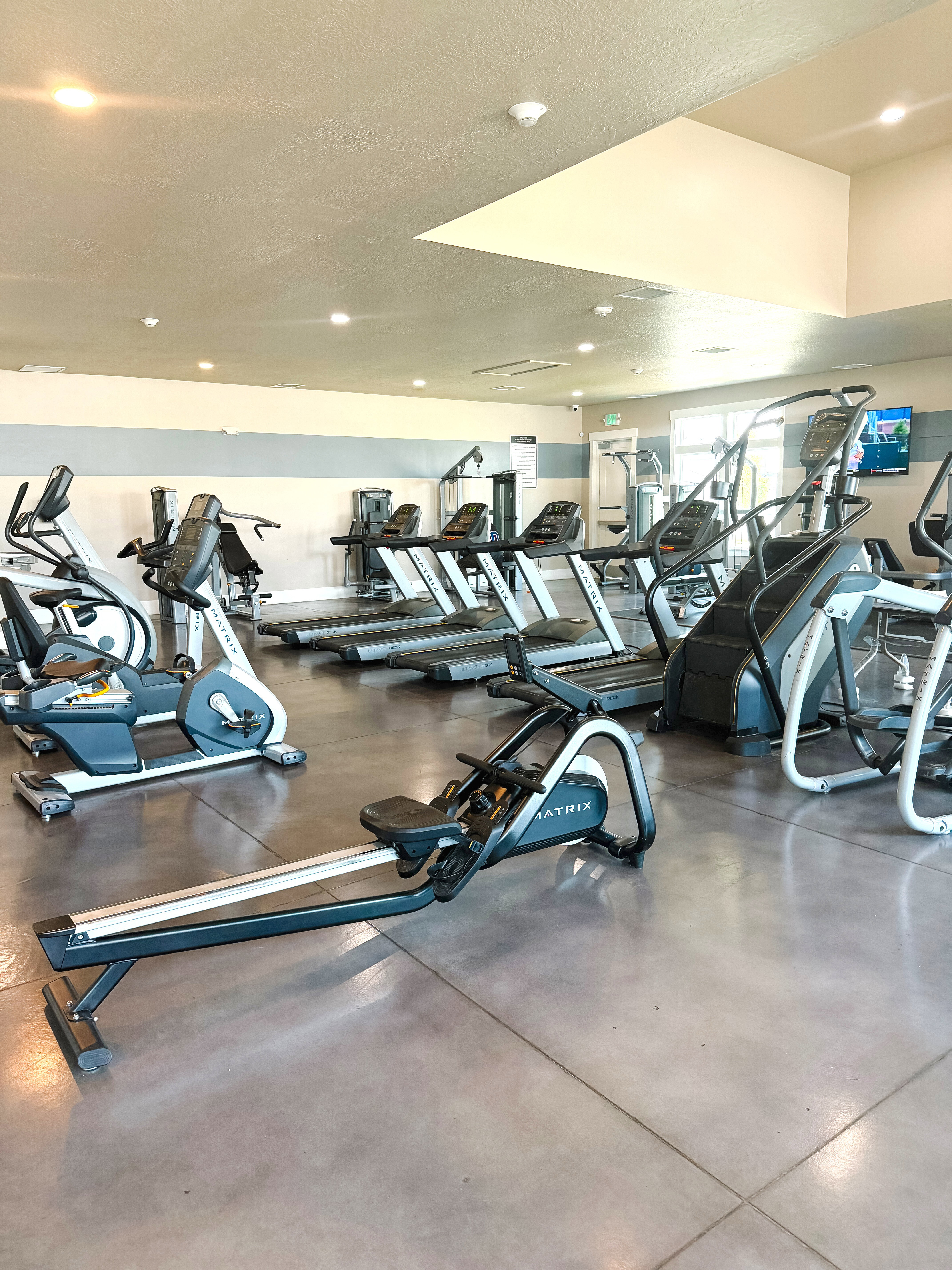 Workout area featuring a textured ceiling and recessed lighting