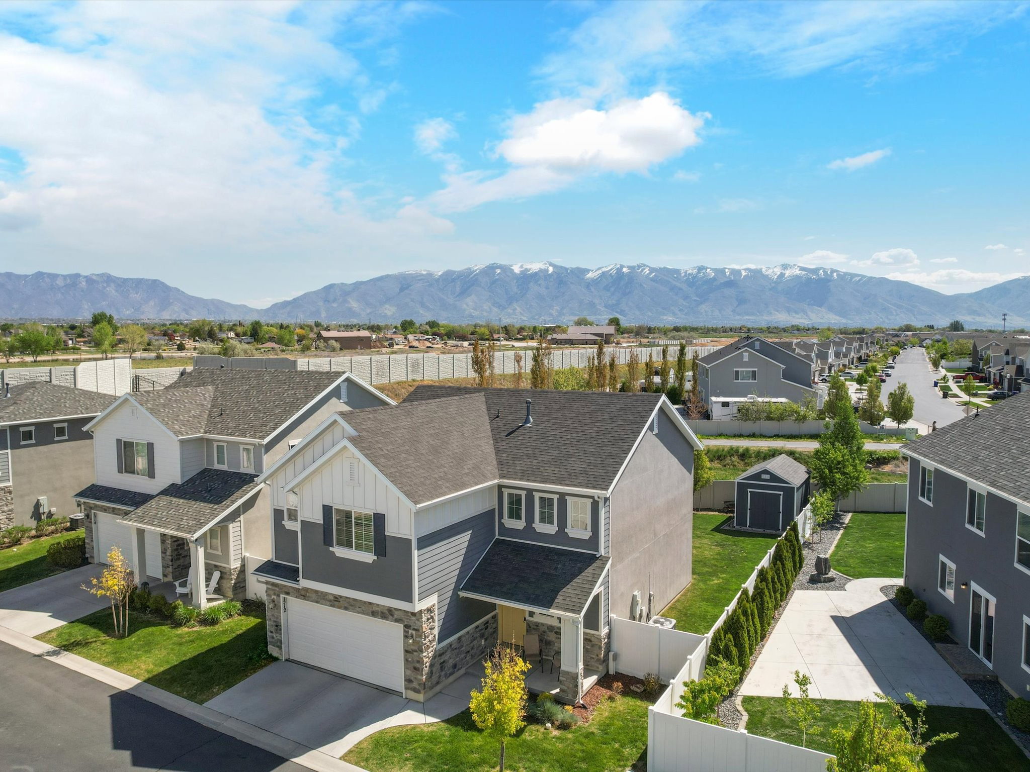 Aerial perspective of suburban area with a mountain backdrop