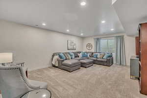 Living room featuring light carpet and recessed lighting