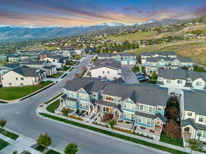Aerial perspective of suburban area featuring a mountain backdrop