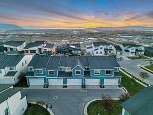 Aerial view at dusk of a residential view and a mountain view