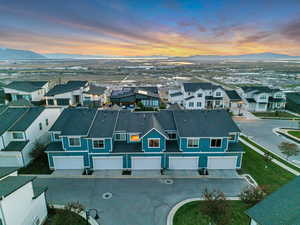 Aerial view at dusk of a residential view and a mountain view