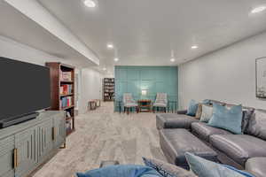 Living area featuring recessed lighting and light colored carpet