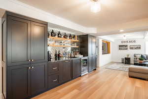 Fully renovated walkout lower level with abundant natural light, new LVP flooring, and a custom bar—ideal for entertaining or relaxed living