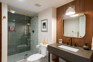 Updated lower-level bathroom featuring modern finishes and clean, functional design to complement the remodeled space