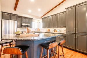 Thoughtfully updated kitchen with quartzite countertops, custom cabinetry, and premium appliances—designed for both everyday living and effortless entertaining