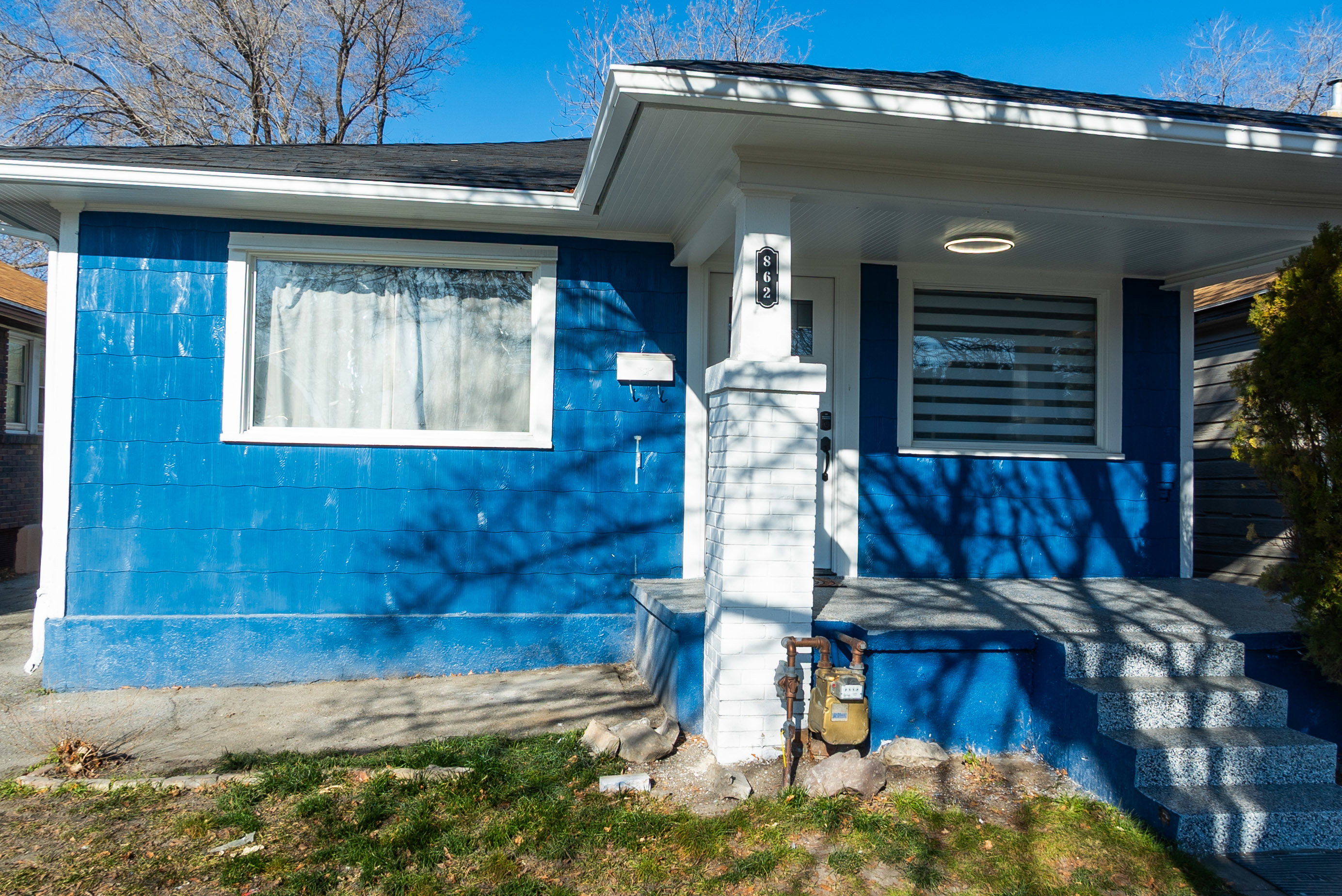 View of property exterior with covered porch