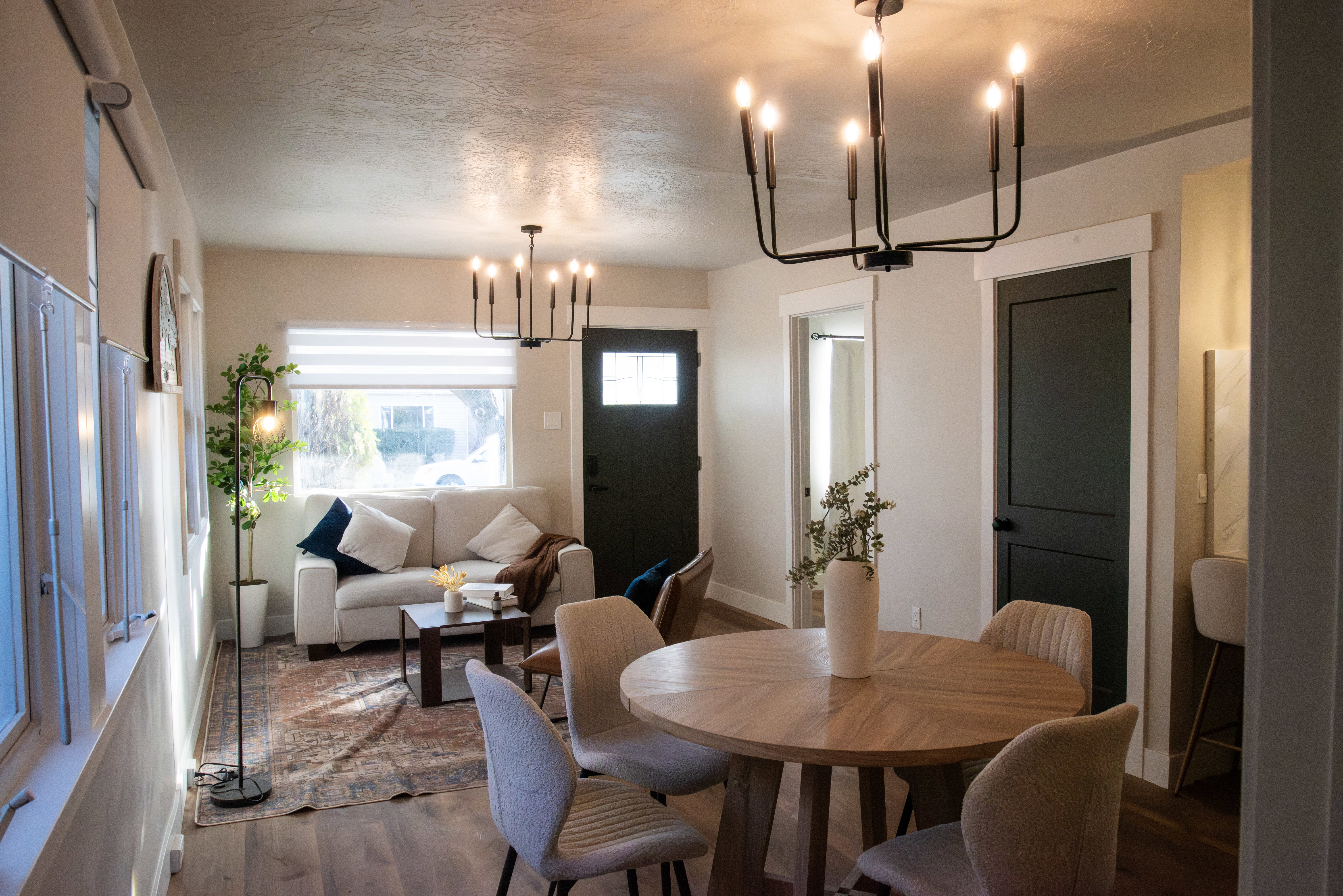 Dining room with a chandelier, wood finished floors, and a textured ceiling