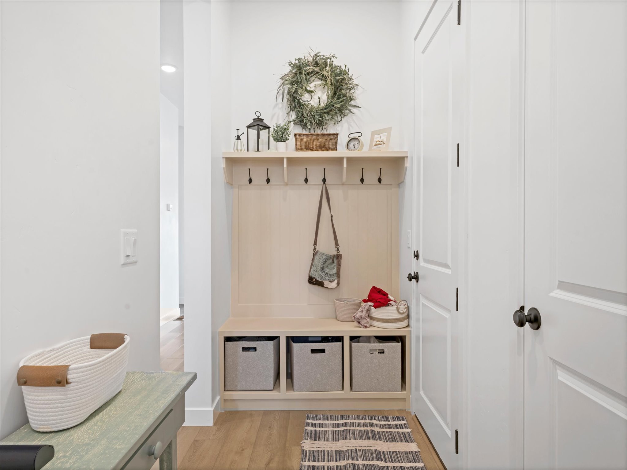Mudroom with light wood-style flooring