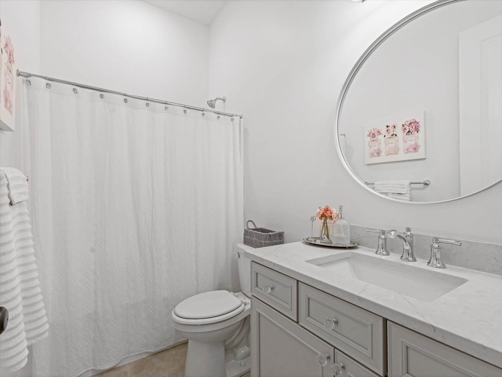 Bathroom featuring vanity and a shower with shower curtain