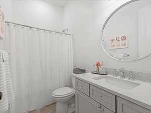 Bathroom featuring vanity and a shower with shower curtain