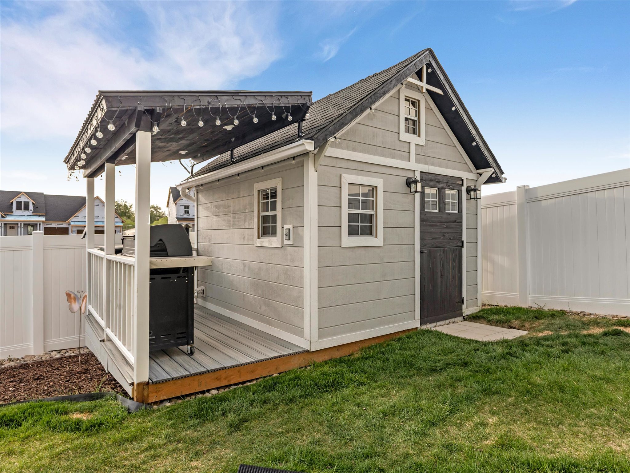 View of outdoor structure with a fenced backyard