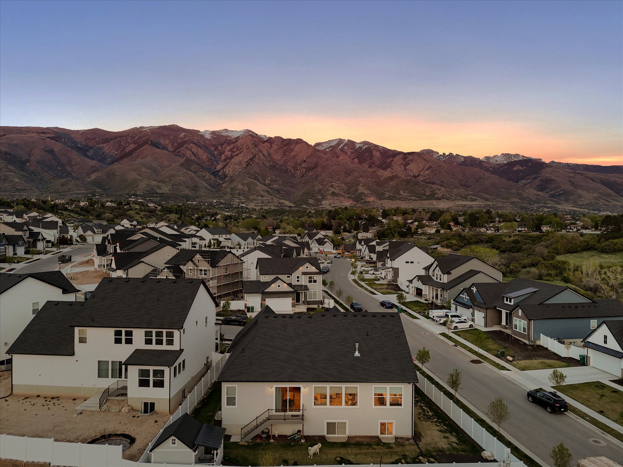Aerial view at dusk of a mountain view and a residential view
