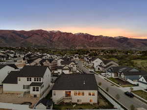 Aerial view at dusk of a mountain view and a residential view