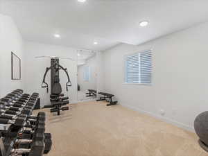 Workout room featuring light carpet and recessed lighting