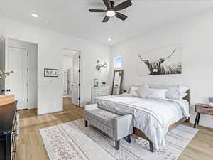 Bedroom featuring ceiling fan, light wood-style floors, and recessed lighting