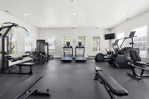 Exercise room featuring recessed lighting