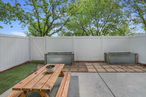 Fenced backyard with a patio area