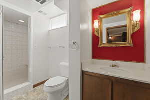 Bathroom with vanity and a stall shower