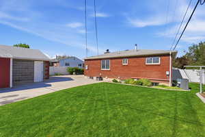 Back of house with brick siding
