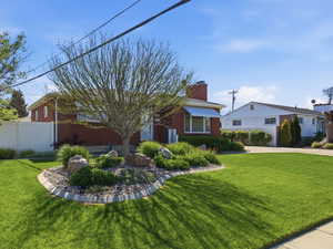 View of front of home featuring a chimney