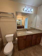 Bathroom with vanity and a textured ceiling