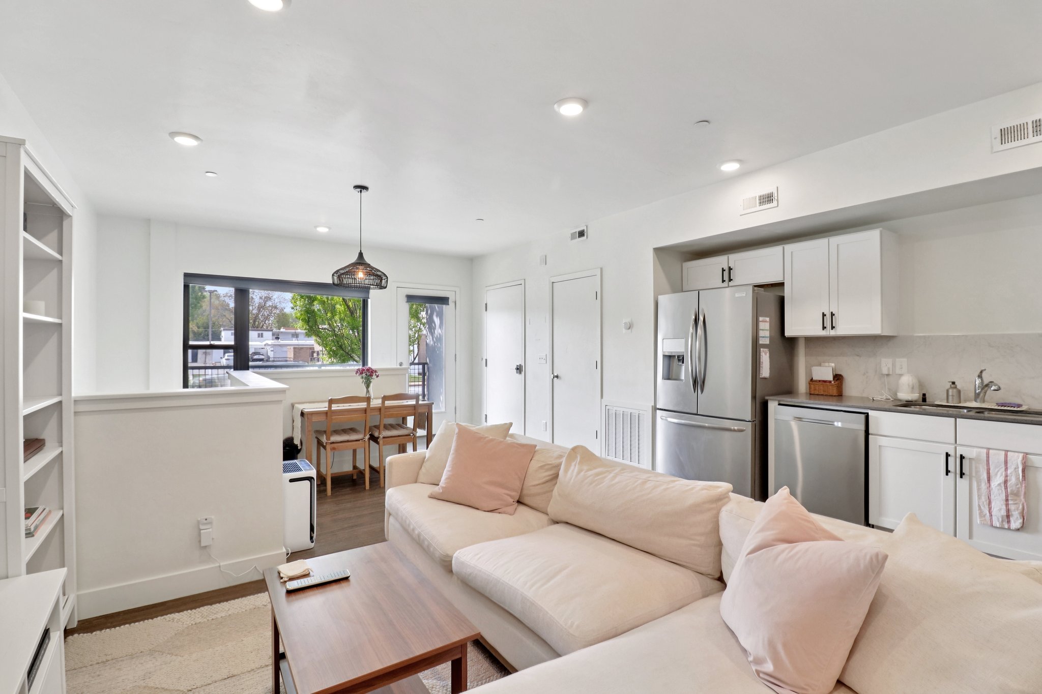 Living room with light wood-style floors and recessed lighting
