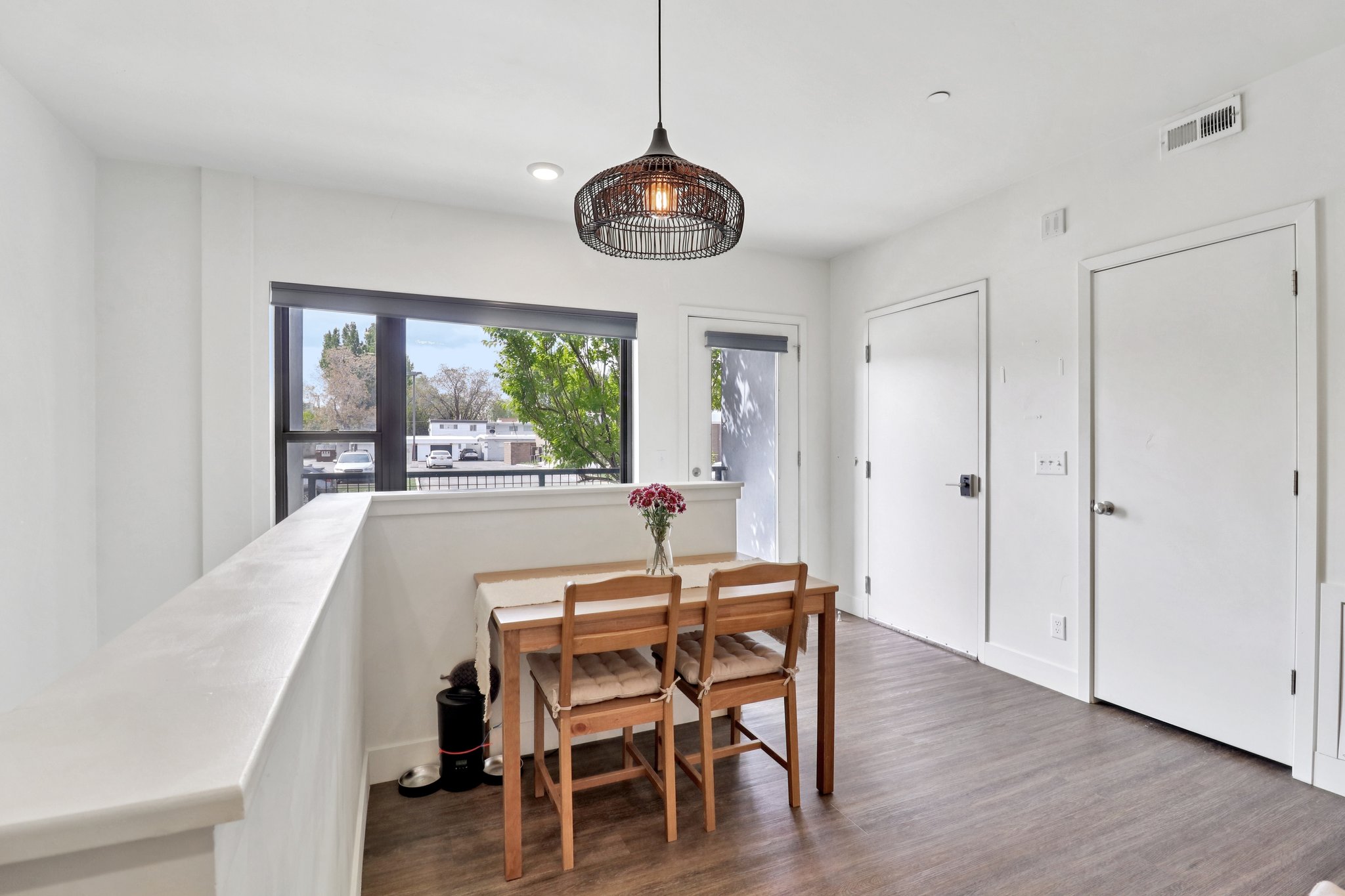 Dining room with dark wood-style floors