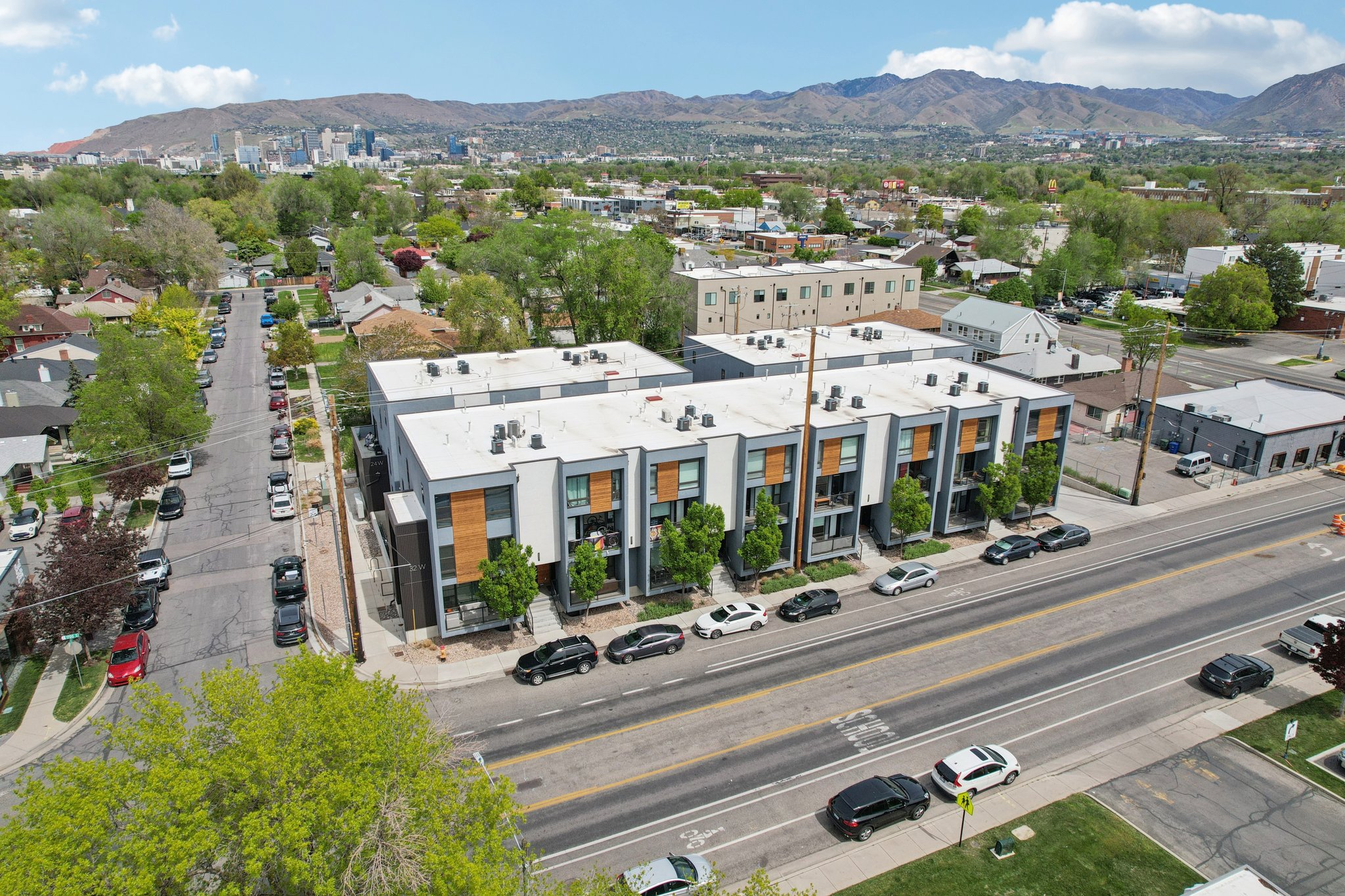 Bird's eye view of mountains and a commercial area