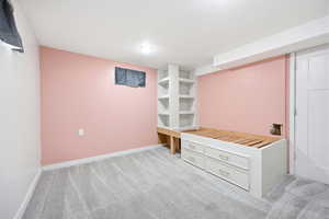 Built-in shelving and platform bed frame with storage drawers