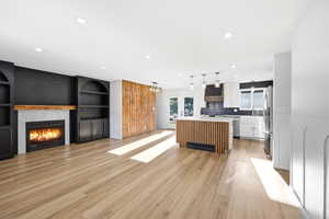 Open-concept living area with wood-finish flooring