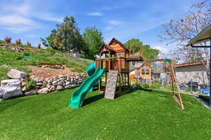 View of jungle gym featuring a yard