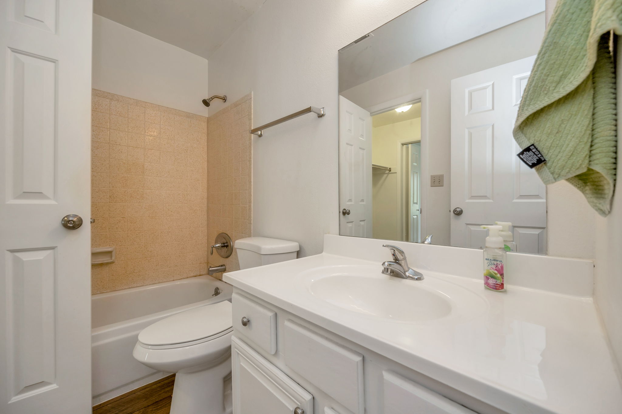 Full bath featuring vanity and  shower/bath combination